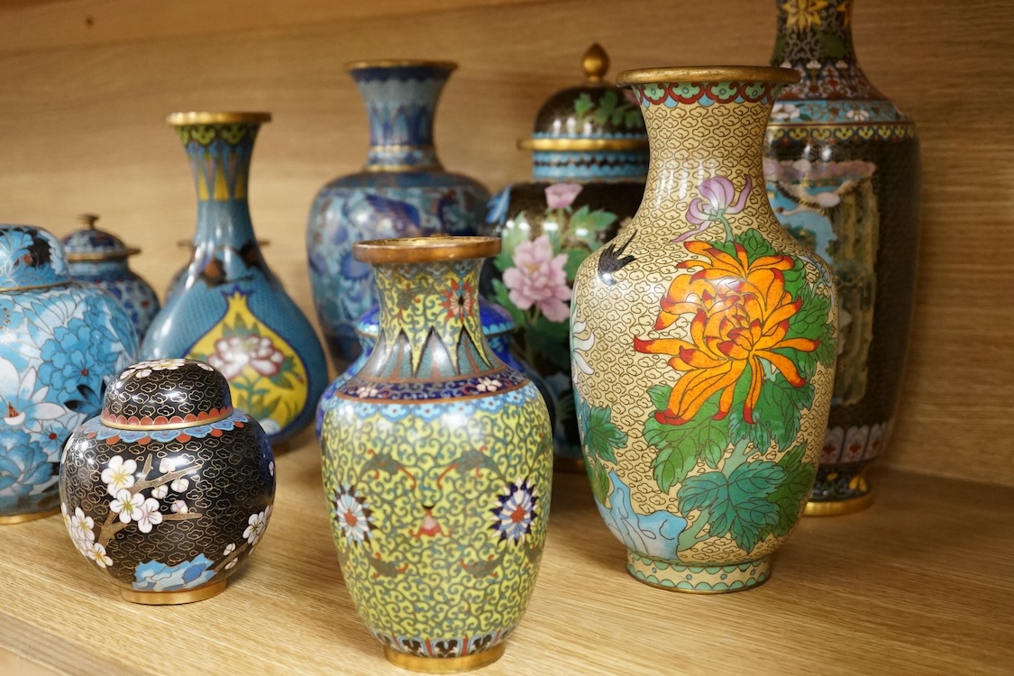 Thirteen various sized Chinese cloisonné enamel jars with covers and similar vases, tallest vase 31cm high.